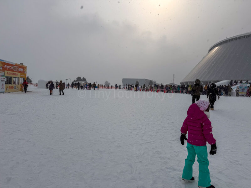 a child at the tsudome site at sapporo snow festival