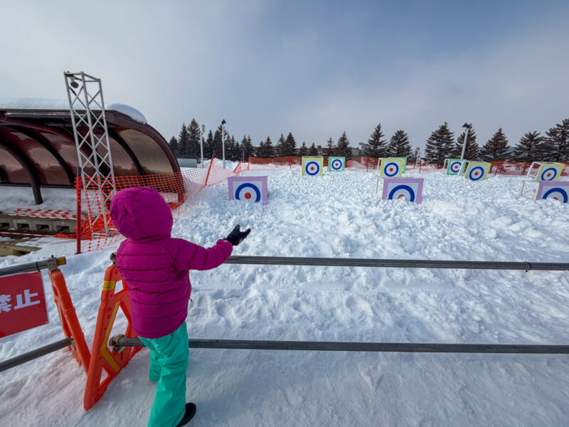 a child snowball throwing at tsudome site sapporo snow festival