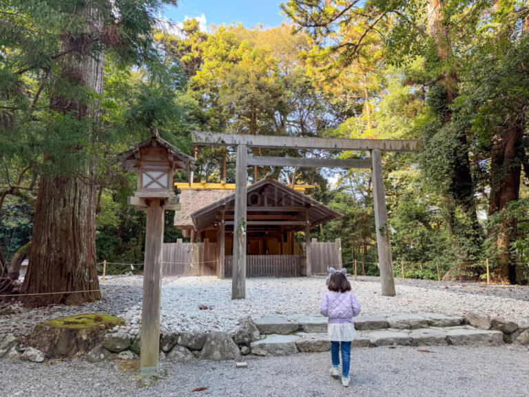 a child praying at a sub-shrine of Ise Jingu in Mie prefecture