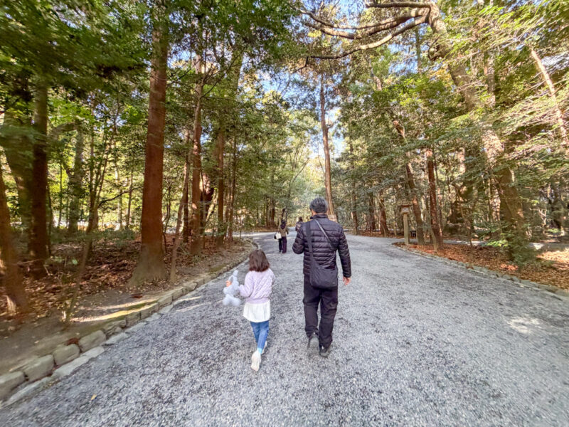 a child and parent walking in ise jingu