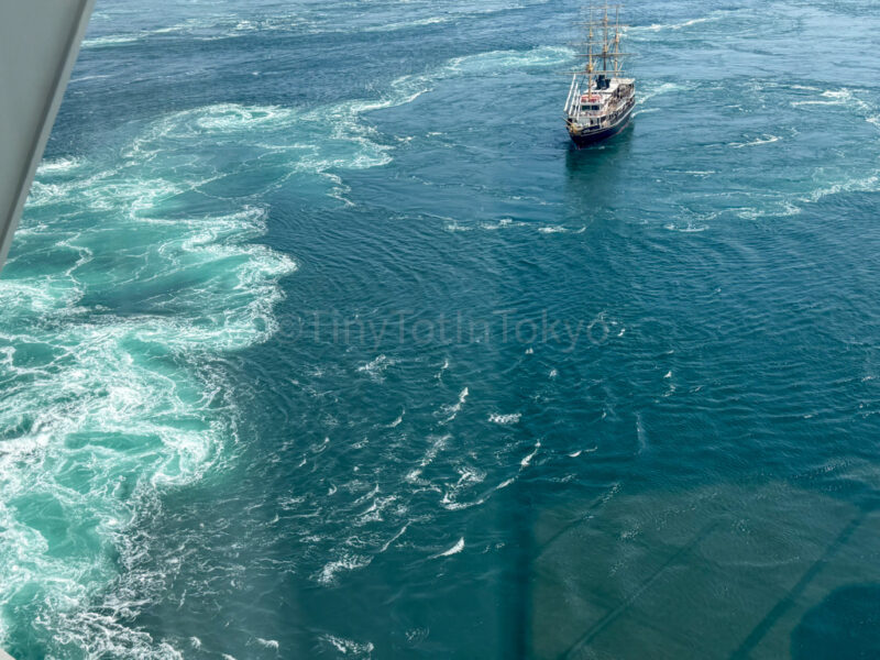 Naruto Whirlpools Cruise boat going up to whirlpool 
