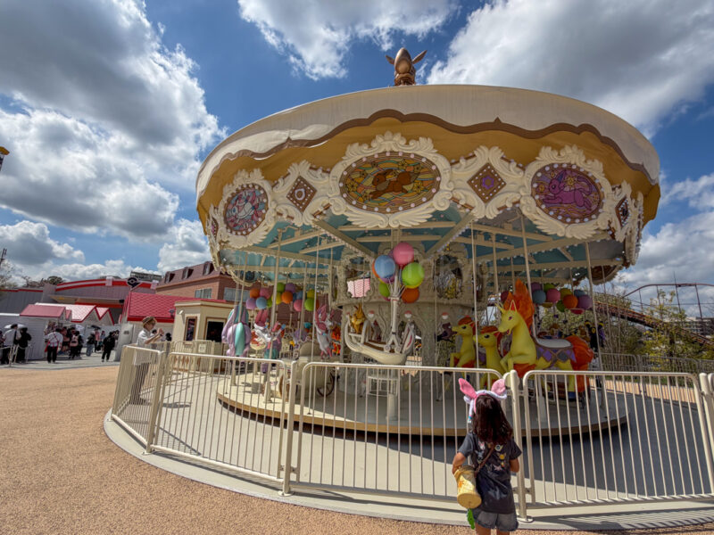 a child standing in front of Vee Vee Voyage at PokePark Kanto