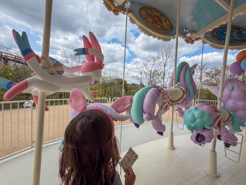 a child riding on vee vee voyage at pokepark kanto