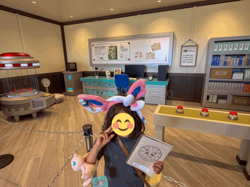a child with a research book at pokemon forest at pokepark kanto