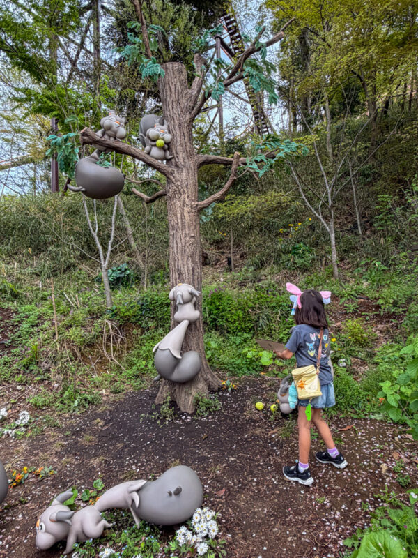 a child looking at pokemon in pokemon forest at pokepark kanto