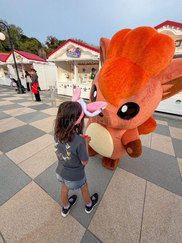 a child with vulpix at pokepark kanto