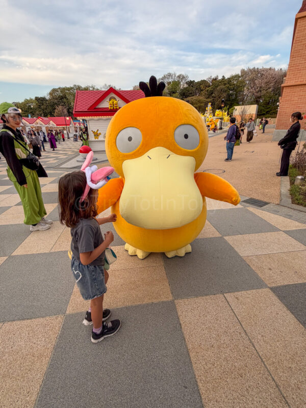 a child with psyduck at pokepark kanto