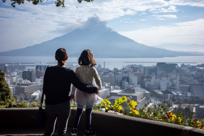 a parent and child at shiroyama observation deck in Kagoshima