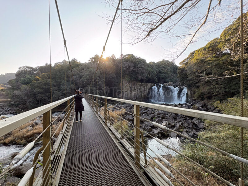 the author on the bridge to sekinoo falls in kagoshima