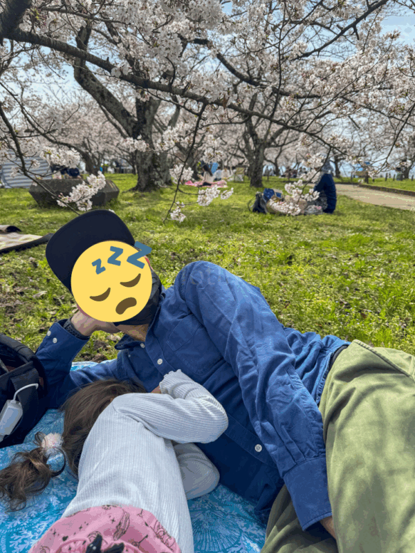 a child and parent relaxing near Nagahama Castle in Shiga