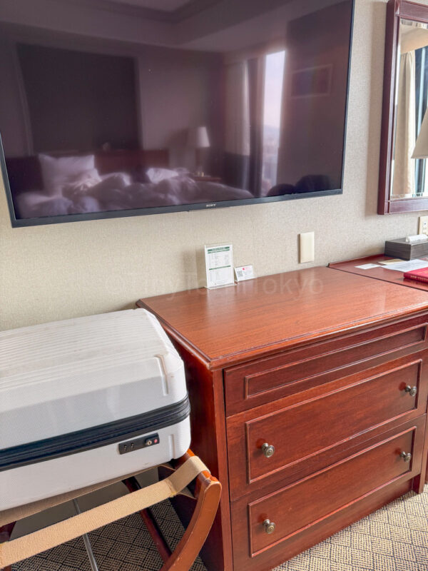 luggage and dresser in room at Shiroyama hotel kagoshima