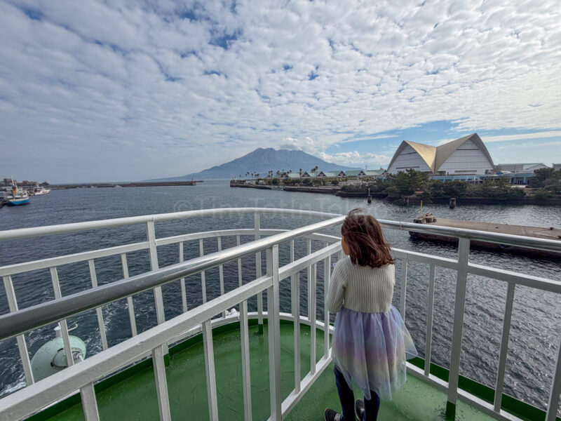 standing outside on the ferry for sakurajima