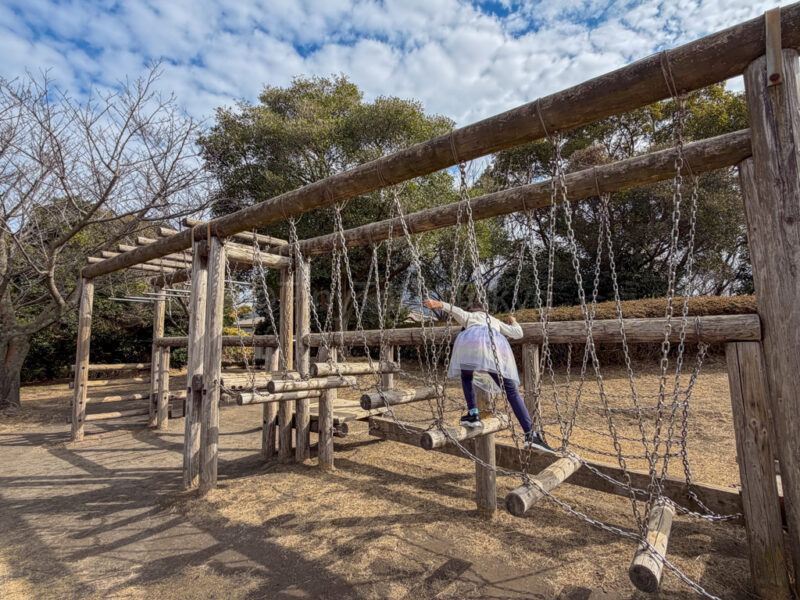 a child playing at Sakurajima Natural Dinosaur Park.