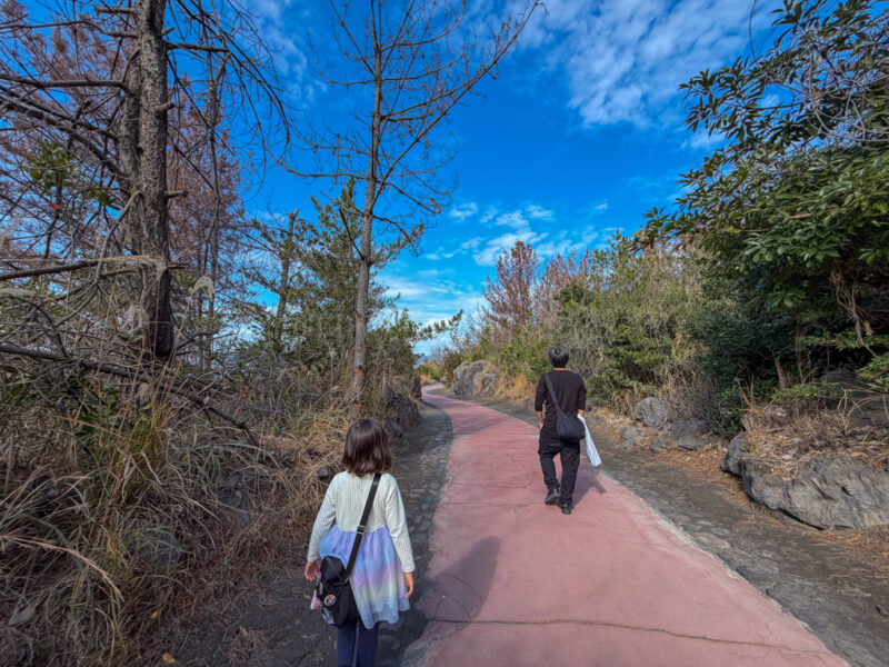 a parent and child walking yogan nagisa trail in sakurajima