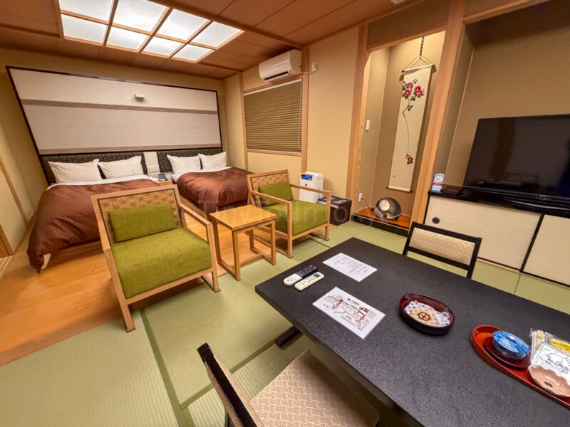 beds in room at Shikinoyado Meisui ryokan in Kagoshima