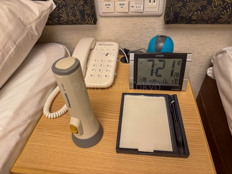 flashlight and outlet near bed at Shikinoyado Meisui ryokan in Kagoshima