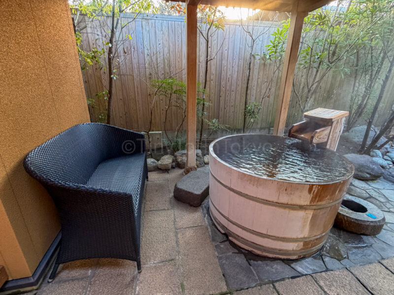seating area next to open air onsen bath at Shikinoyado Meisui ryokan in Kagoshima