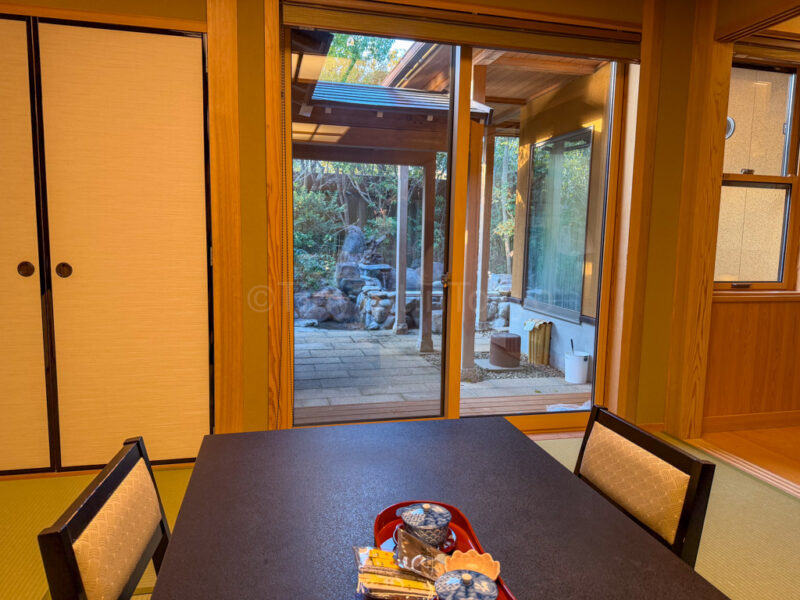 view of open-air onsen from room at Shikinoyado Meisui ryokan in Kagoshima