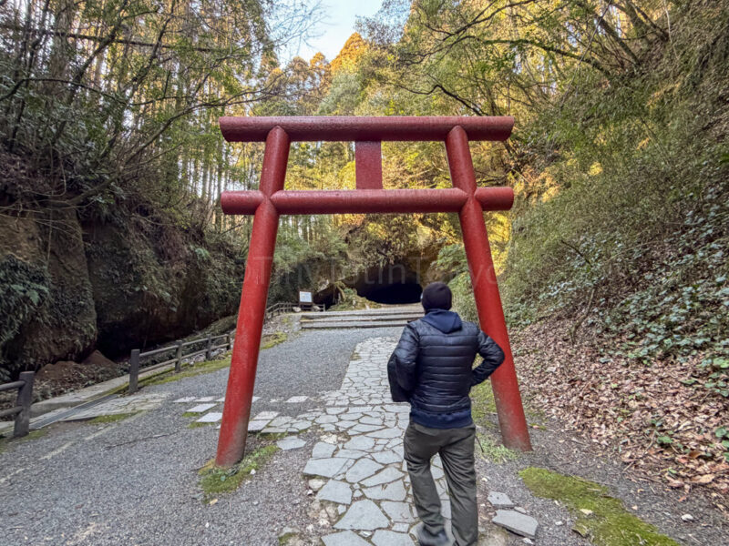 a man walking to Mizonokuchi Cave in kagoshima