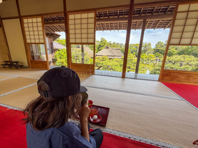 A child enjoying tea at Genkyuen Garden at Hikone Castle in Shiga