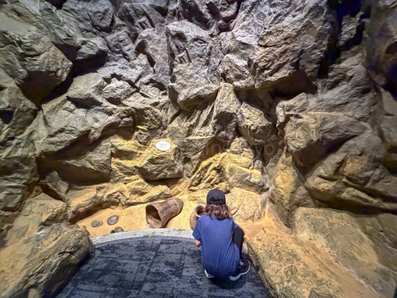 a child looking at jomon pottery at lake biwa museum