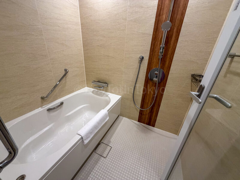 bathtub and shower in garden terrace room at fusaki beach resort ishigaki