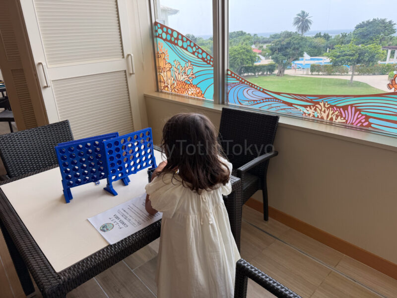 child playing a board game at ANA InterContinental Ishigaki Resort