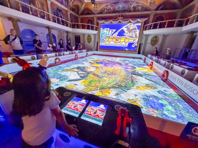 child at fishing adventure game at huis ten bosch
