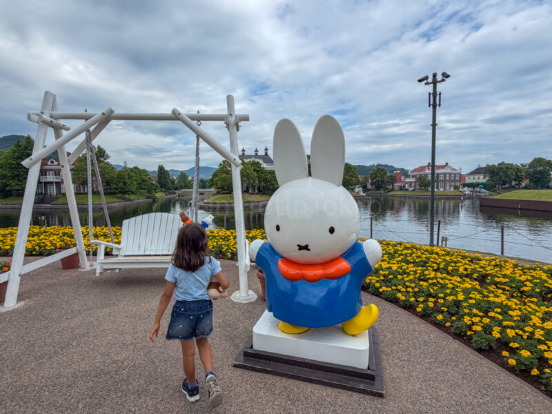a child with miffy at flower road in Huis Ten Bosch
