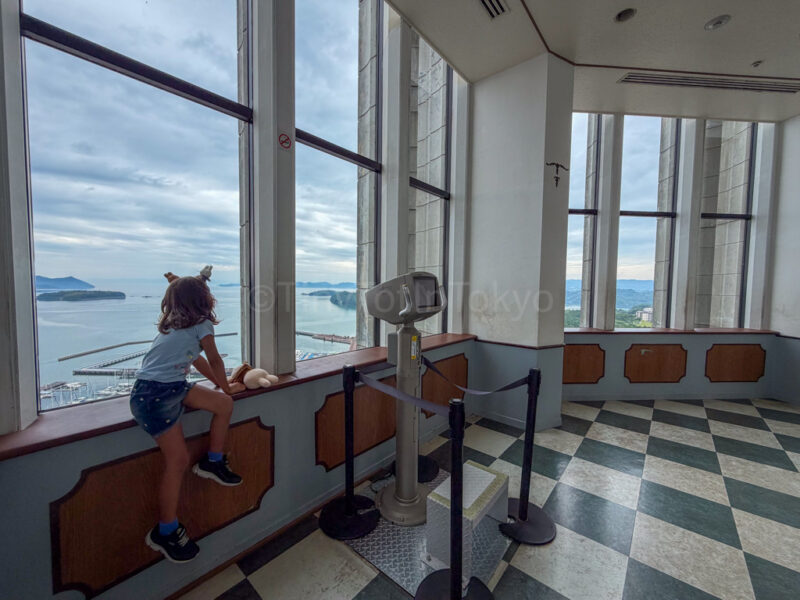 a child looking out from the domtoren tower at huis ten bosch