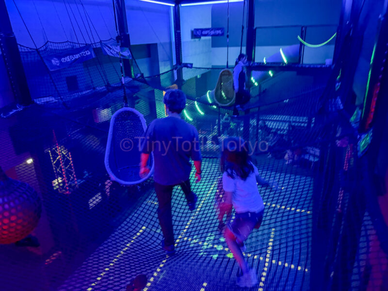 a parent and child at sky floor at huis ten bosch