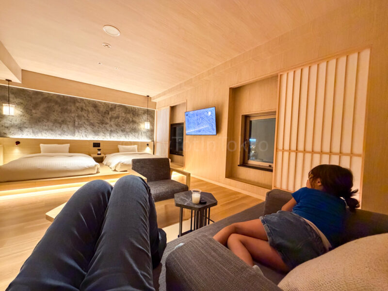 television and couch in luxury floor twin room at one station hotel kumamoto
