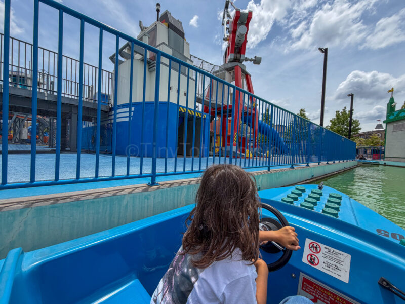 a child riding on coast guard HQ at legoland japan