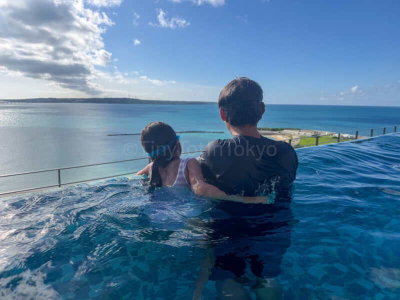 parent and child in the rooftop pool at canopy by hilton in okinawa miyako island