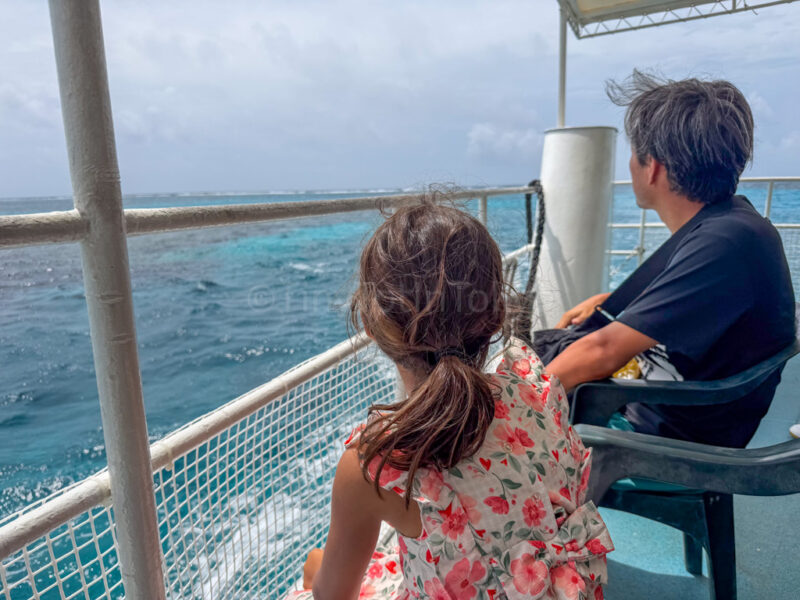 a parent and child on a boat tour in Miyakojima