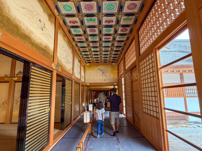 a parent and child inside honmaru palace in nagoya