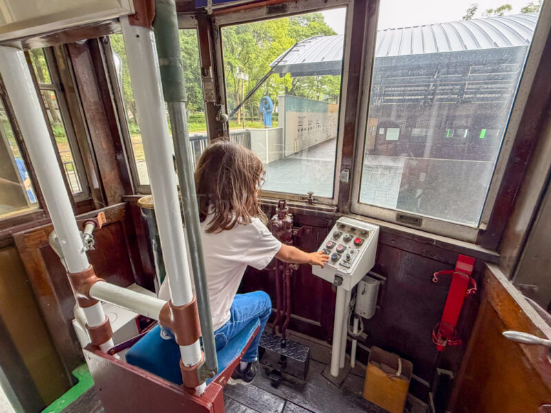 child inside train near nagoya city science museum