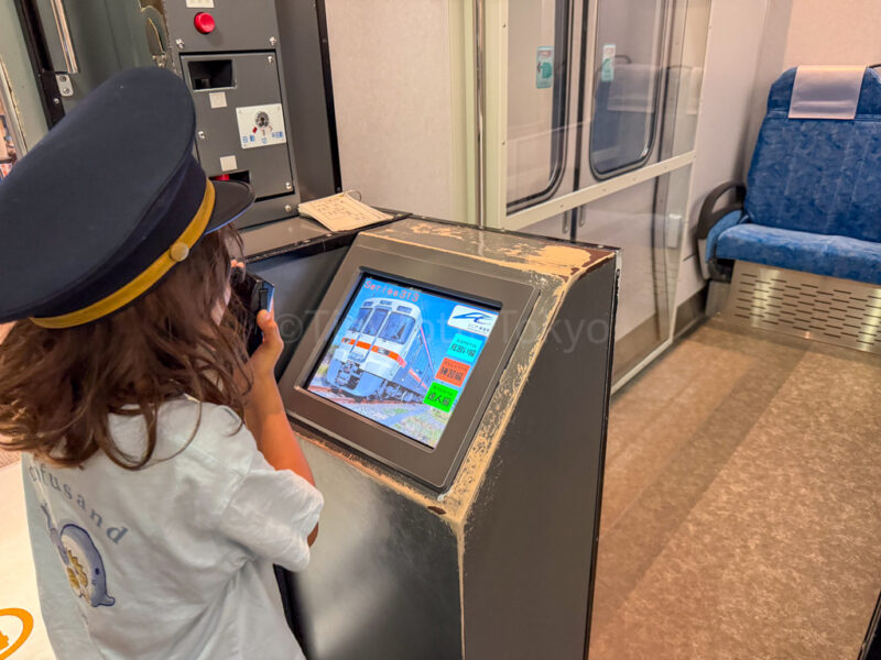 a child being a train conductor at SCMAGLEV and Railway Park