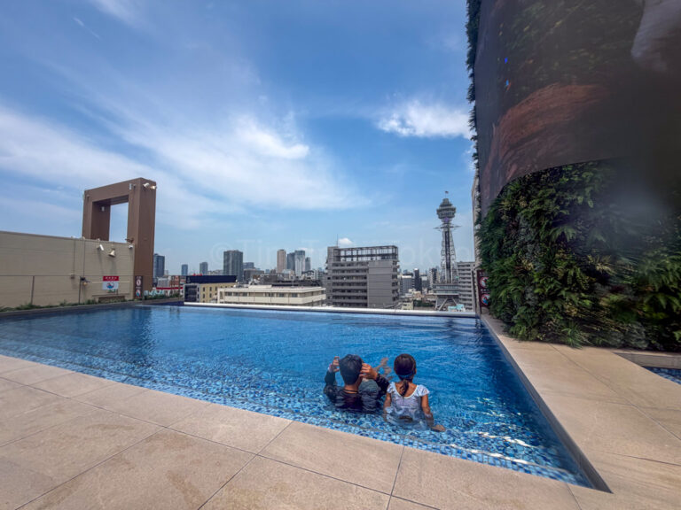a child and their parent at Spa World Osaka