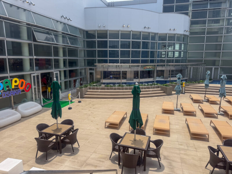 loungers and table at terrace area in spa world osaka