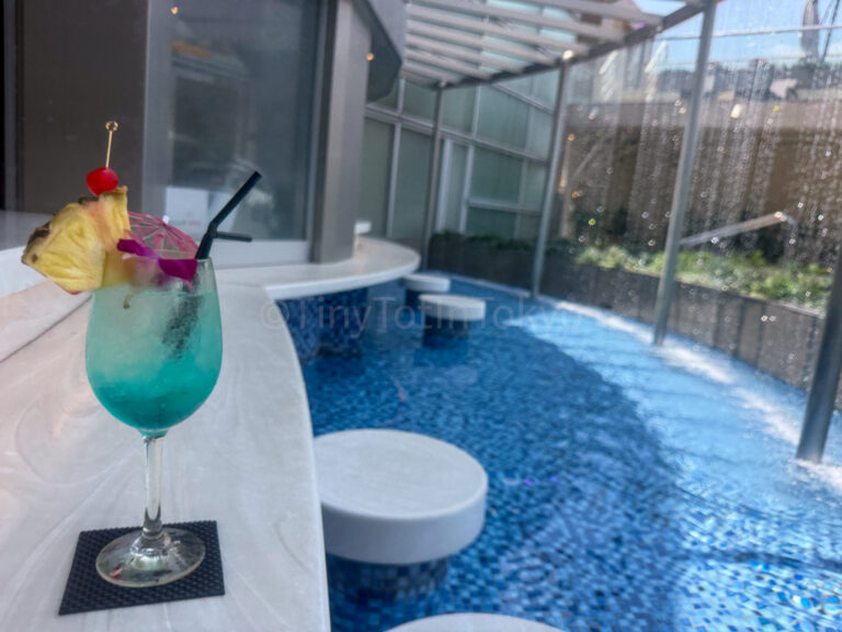 a drink at the pool at Spa World in Osaka