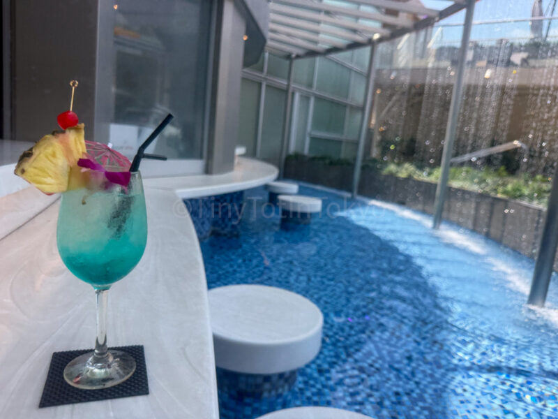 a drink at the pool at Spa World in Osaka