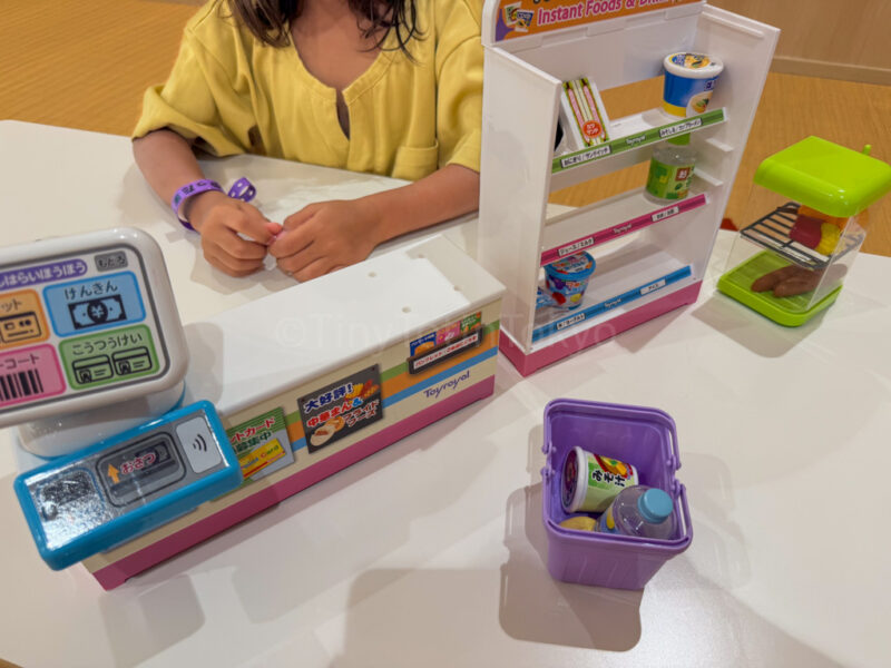 child playing with toys at play area for kids at yuttamari spa world osaka