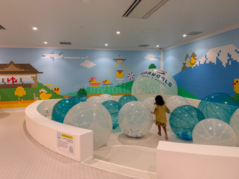 a child playing in the play area for kids at yuttamari spa world osaka